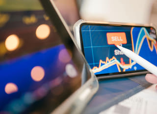 Trader across multiple markets reviewing Bitcoin, Ethereum and forex options